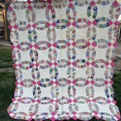 a large quilt is on the grass outside