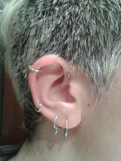 a person with ear piercings on their ears