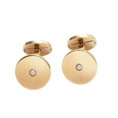 A pair of Cartier diamond and gold disc cufflinks, with a round brilliant-cut diamond in the centre of each polished disc, with flat curved fixed bar links, hinged at one end, onto smaller gold discs, signed Cartier, in script and capitals, dated 1997,  with 750 fineness and Convention marks, numbered F 53533, with a dog mark, with B on the ear, with Italian mark, numbered *1140 MI, which is the registration number for Richemont, who own many of the world's leading names in the field of luxury g Jewelry Redesign, Cartier Diamond, Diamond Cufflink, Gemstone Brooch, Van Cleef And Arpels, Dress Sets, Gold Cufflinks, Gold Disc