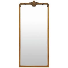 a mirror that is sitting on top of a table with a wooden frame and gold trimming