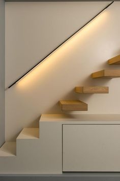 the stairs are made of wood and have lights on them