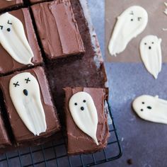 chocolate squares decorated with white icing and ghost faces