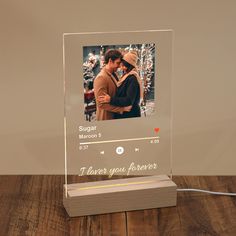 a glass photo frame with an image of a couple kissing