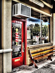 an empty bench in front of a store