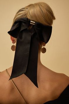 Indulge in a touch of luxury with our Glossy Satin Bow Barrette. Featuring an ultra elevated bow with a metal center, this barrette offers a sophisticated and exclusive touch to any hairstyle. Available in two sleek color options, add a soft satin fabric to your look. Black Tie Optional, Glam Boho, Bow Barrette, Blusher Veil, Halo Headband, Headband Jewelry, Cocktail Jewelry, Padded Headband, Satin Bow