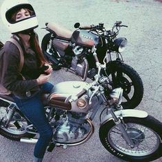 a woman wearing a helmet sitting on a motorcycle