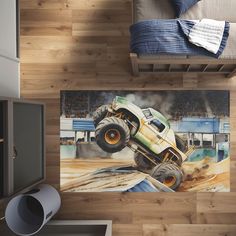 a bed room with a large painting of a monster truck on it's side