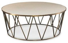 a round table with metal frame and glass top on a white background for use as a coffee table or end table