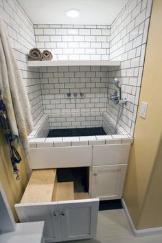 a bathroom with a sink, cabinet and toilet