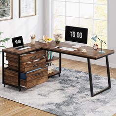 a wooden desk with two laptops on it