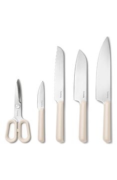 five knives and two scissors are shown in this image