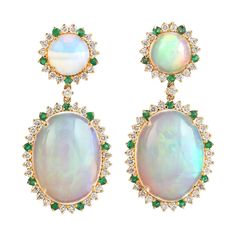 Cast in 14 karat gold. These earrings are hand set in 13.05 carats Ethiopian opal, .34 carats emerald, and .82 carats of sparkling diamonds. FOLLOW MEGHNA JEWELS storefront to view the latest collection & exclusive pieces. Meghna Jewels is proudly rated as a Top Seller on 1stDibs with 5 star customer reviews. All items manufactured by us are handmade and can be customized or redesigned. Composition Size-32X15 MM Total Weight-7.845 Gold Weight(Gms)-5.004 Diamond Wt(Cts)-0.82 Opal Wt(Cts)-13.05 Emerald Wt(Cts2)-0.34 Formal Opal Gemstone Earrings, Oval Opal Earrings For Formal Occasions, Formal Oval Opal Earrings, Luxury Ethiopian Opal Formal Jewelry, Elegant Green Ethiopian Opal Jewelry, Opal Jewelry Set, Vintage Drop Earrings, Top Seller, Love Ring