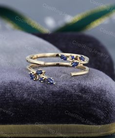 Ring enhancer Double bands stacking ring Yellow gold wedding band Natural blue sapphire open ring Bridal ring Anniversary gift for women Stone SPECIFICATIONS Stone: Natural blue sapphire Carat Weight: approx. 0.2ct Marquise 3*1.5mm *6 Round 1.3mm *2 Band SPECIFICATIONS Can be made in 14k or 18k rose gold / white gold / yellow gold. MAKING & SHIPPING TIME Handmade in my American studio，The making process is about 2-3 weeks. Us domestic shipping time: 3-5 days International shipping time: 5-12 Nature Wedding Band, Open Wedding Band, Blue Wedding Band, Ring Enhancer, Blue Diamond Ring, Something Blue Wedding, Gold Topaz, Yellow Gold Wedding Band, Sapphire Wedding