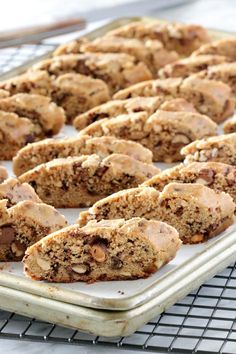 a tray full of cookies on top of a cooling rack