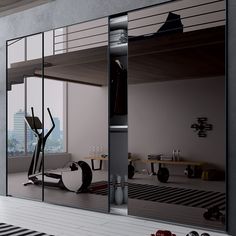 an exercise room with mirrored walls and mirrors