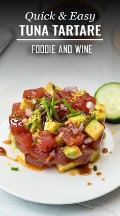 a white plate topped with food next to a cucumber and tomato wedges