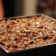 a pan filled with food sitting on top of a table