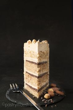 a piece of cake sitting on top of a black plate