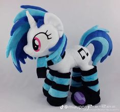 a plush toy with blue and black stripes on it