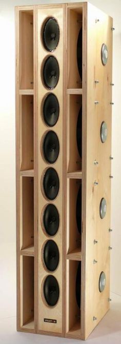 a wooden cabinet with several speakers in it