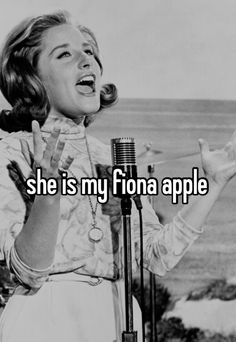 a woman singing into a microphone with the caption she is my fion apple