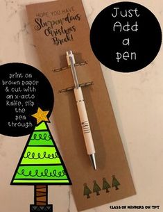 a pen sitting on top of a piece of paper next to a christmas tree card