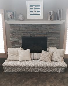 a living room with a couch and fireplace