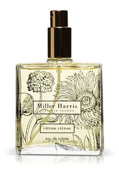 a bottle of perfume with flowers on it