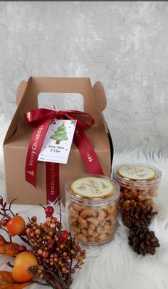 an open box filled with nuts next to other items on a white furnishing