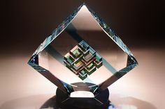 a crystal diamond shaped object sitting on top of a table