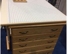 a desk with several drawers on top of it