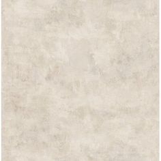 an old, dirty white wallpaper with faded edges