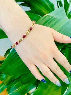 Stunning Vintage 14K Yellow Gold Diamond Ruby Bracelet: Stunning Genuine Diamonds and Natural Ruby 11 pc oval shape 6x4mm Ruby(s): 7.50CT Diamond(s): 0.28CT Color: G Clarity: SI2 Total Bracelet Weight: 11.0GR Bracelet Length: 7in Bracelet Width: 1/2cm 14K Yellow Gold For more information regarding this item feel free to reach me so I can accommodate your needs. Thank you Formal Oval Gold Bracelet With Gemstones, Oval Gold Bracelet With Gemstone For Formal Occasions, Gold Oval Tennis Bracelet As Gift, Oval Gold Gemstone Bracelet For Formal Occasions, Gold Ruby Tennis Bracelet For Anniversary, Oval Gold Bracelet With Gemstone For Anniversary, Oval Gold Bracelet For Wedding, Formal Oval Gold Gemstone Bracelet, Gold Oval Tennis Bracelet In Fine Jewelry Style