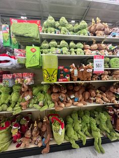 stuffed animals are on display in a store