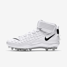 the nike vapor football cleat is white and has black accents on it's upper