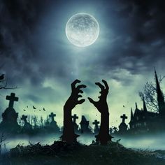 two zombie hands reaching out to each other in front of a full moon and graveyard