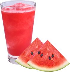 a watermelon slice next to a glass of juice