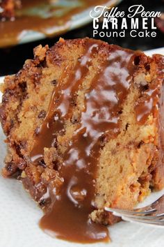 a close up of a piece of cake on a plate with a fork and chocolate icing