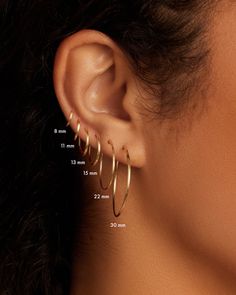 a woman's ear is shown with measurements for the hoops on her ear