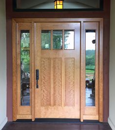 a wooden door with glass panels on the outside