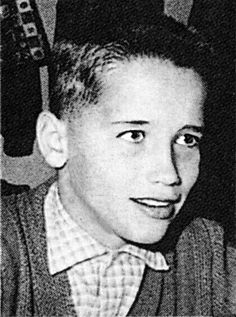 an old black and white photo of a young boy