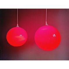 two large red balls hanging from the ceiling