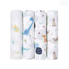 four baby swaddles are lined up in the shape of animals and giraffes