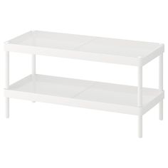 a white shelf with two shelves on each side