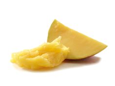 an apple cut in half with the peel still attached to it's core, on a white background