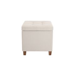 a white ottoman with wooden legs and an upholstered foot rest on the side