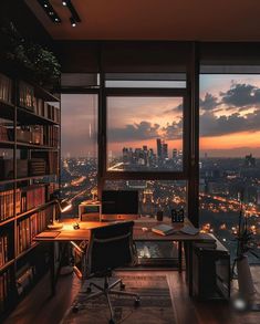 an office with a view of the city at night