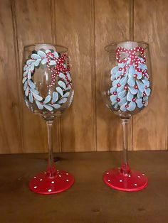 two wine glasses decorated with red, white and blue decorations