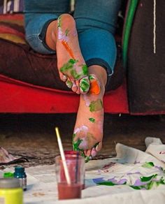 a person with their feet covered in paint