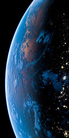 the earth is lit up at night from space